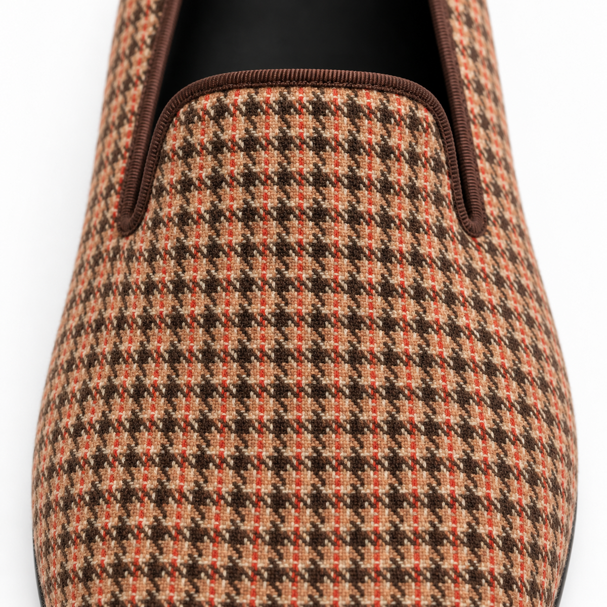 Close-up of the Hawthorne loafer's brown, cream and rust woven check upper and dark brown ribbed trim.